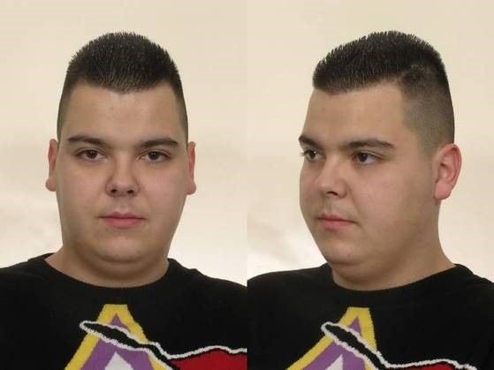 Mugshot of a young man with short hair.