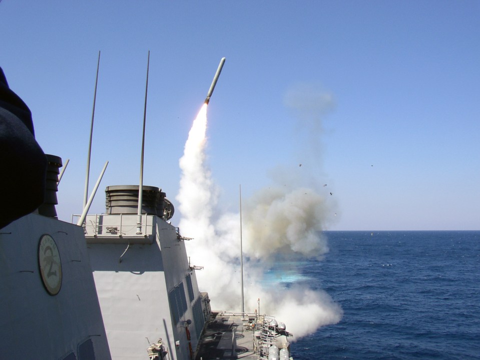 US missile destroyer USS Porter launches a Tomahawk missile last year - also used in yesterday's attacks