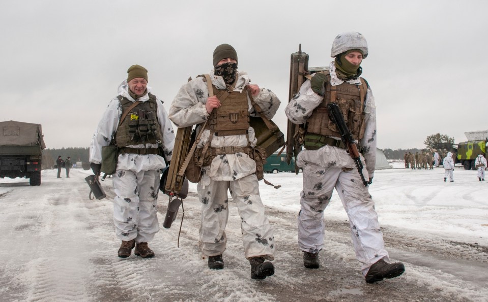 Ukrainian soldiers march close to Kharkiv in Ukraine