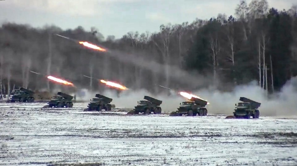 Multiple rocket launchers fire during the Belarusian and Russian joint military drills in 2022 - the leaked doc predicts Russia will begin a major troop buildup in Belarus