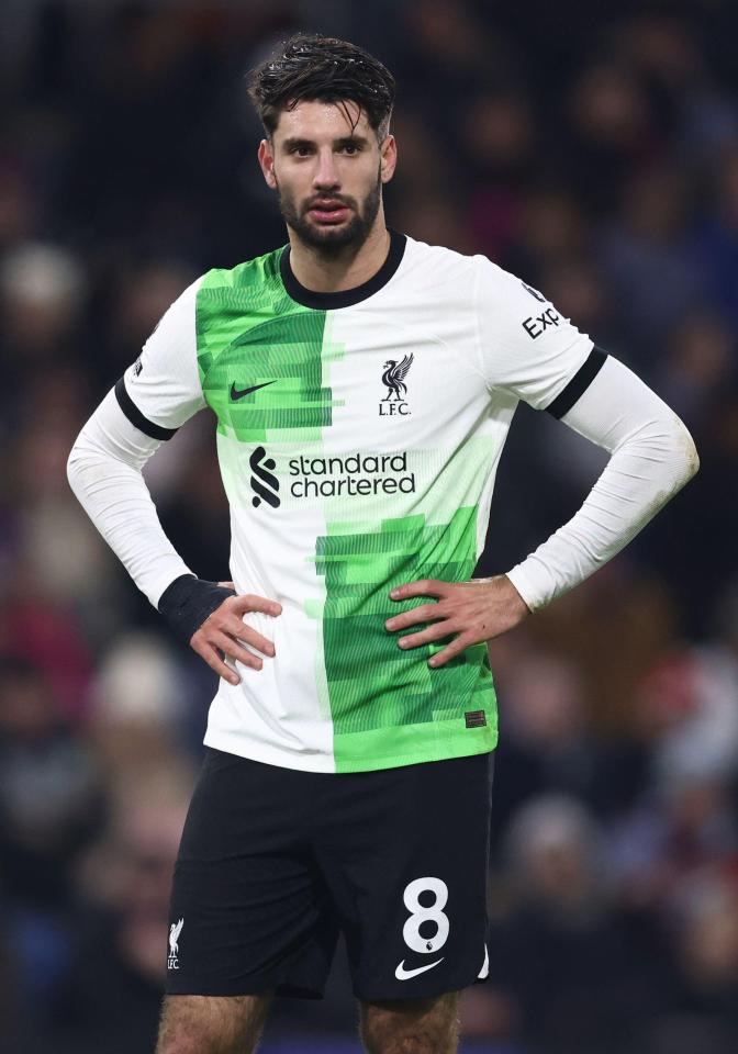 The Reds' away kit is white with green