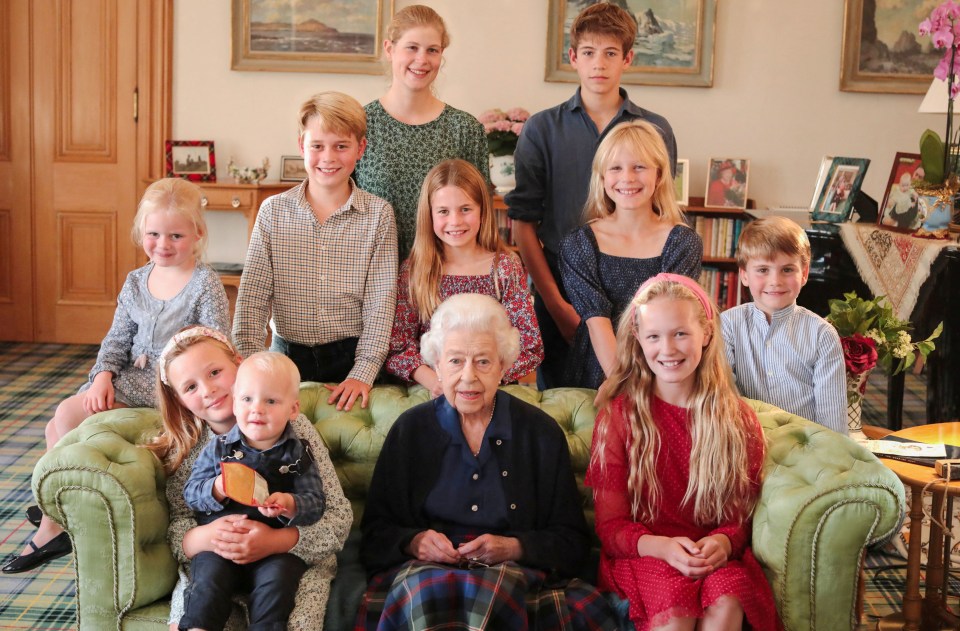 Family portrait of Queen Elizabeth II with her grandchildren and great-grandchildren at Balmoral Palace.