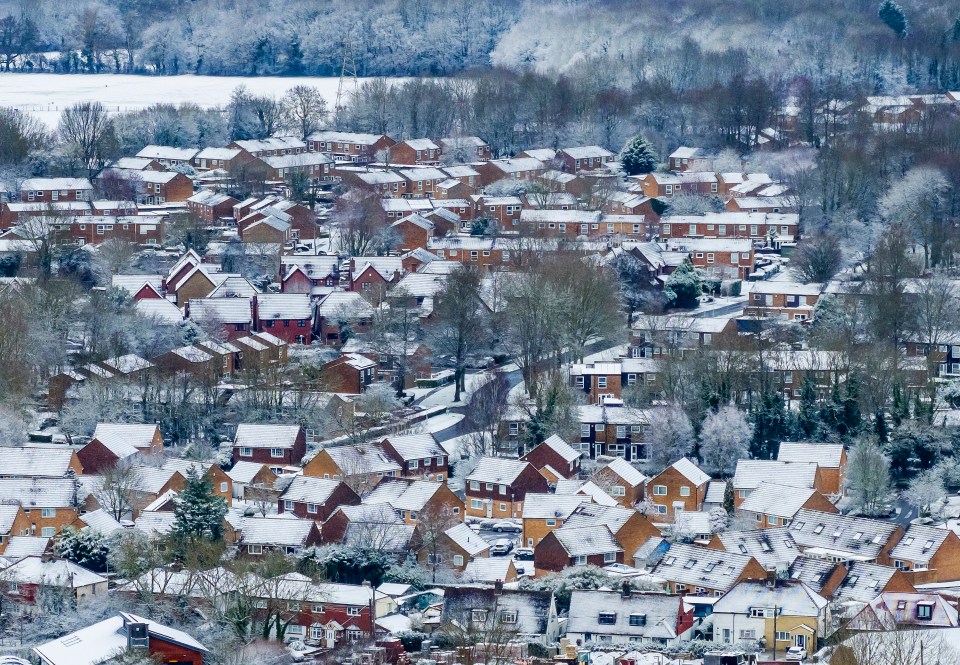 Snow blankets houses at Ash in Kent yesterday afternoon