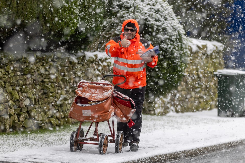 A postie battles the elements to complete his round in Austwick, Yorkshire yesterday