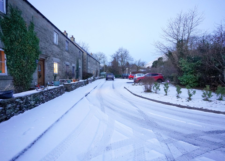 Houses are covered in snow in Edale in the Peak District