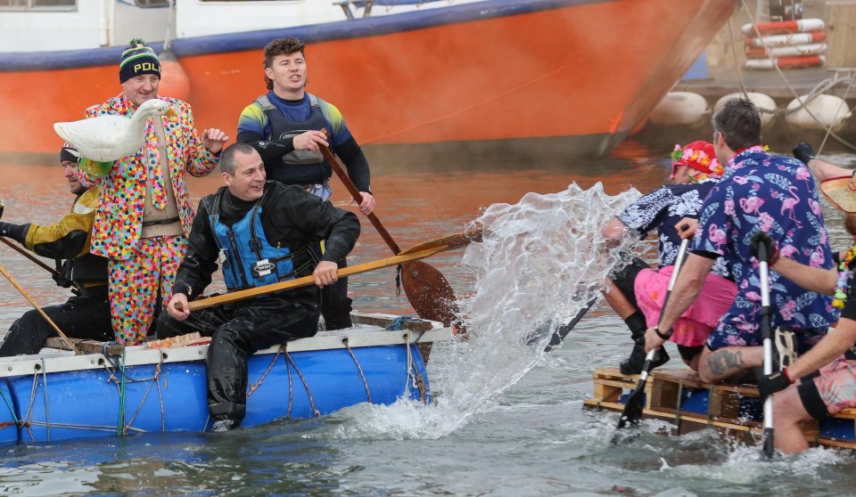 Teams battled it out on the water during the Bath Tub Race on Poole Quay