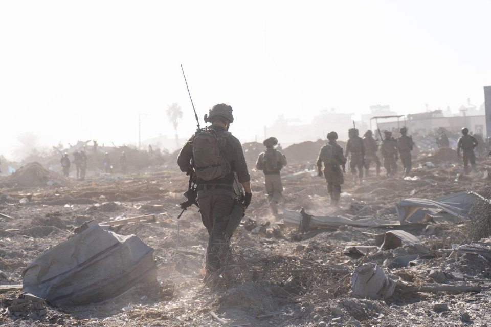 IDF troops make their way through war-torn ground in the Gaza Strip