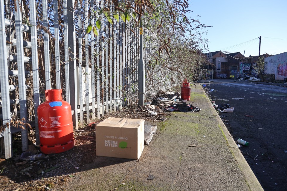 Gas canisters among the debris littering Little Edward Street