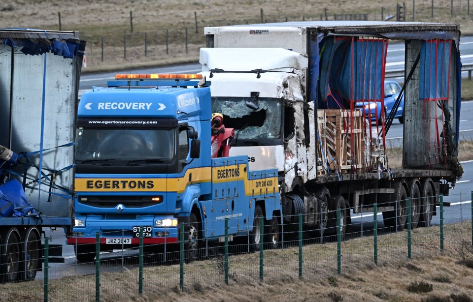 A lorry was badly damaged after strong winds flipped it on the M6