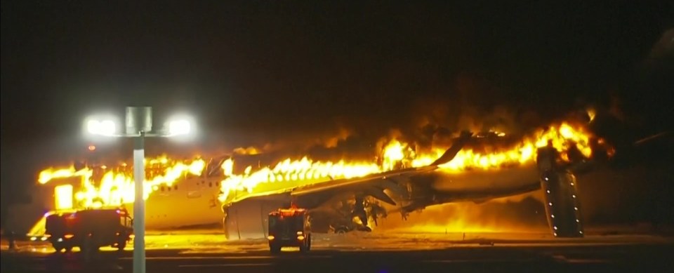 Shocking footage shows flames coming from inside and beneath the plane