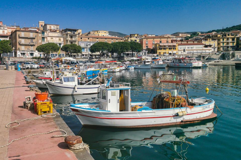 2JG668A Colorful fishing boats moored at Marina di Camerota port. Marina di Camerota, Campania, Italy, June 2022