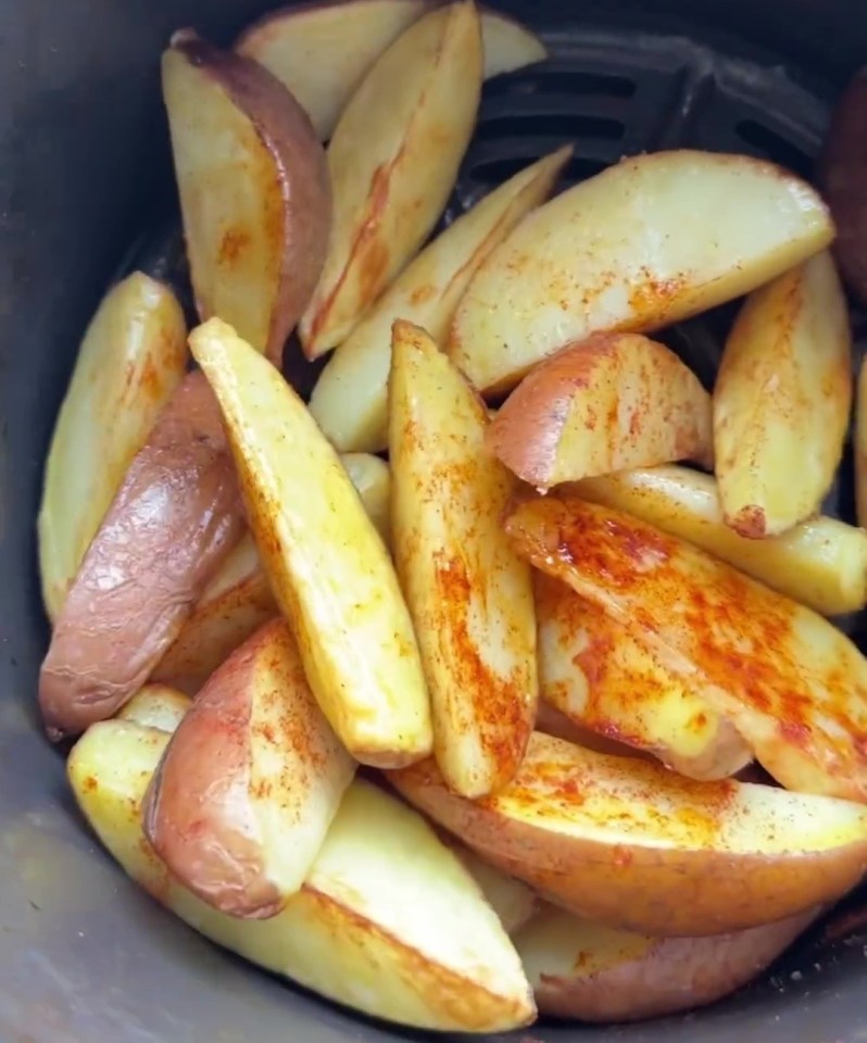 She coats the potatoes with paprika, oil and salt and pepper as well as adding the water and cooking