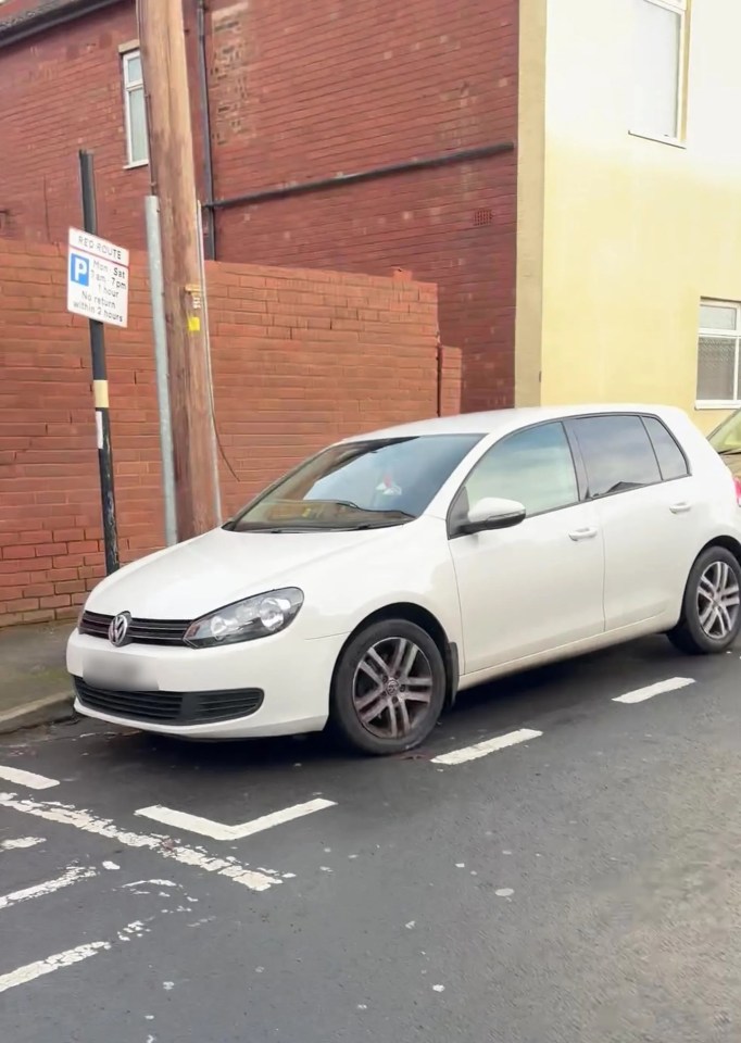 The white Volkswagen appeared to have been legally parked in a bay