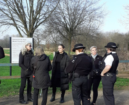 Met officers speak to members of the public at the park