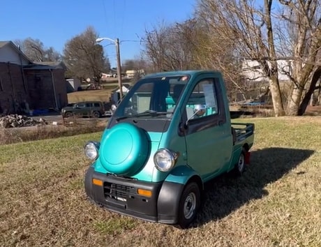 A straight-piped 1997 Daihatsu Midget II