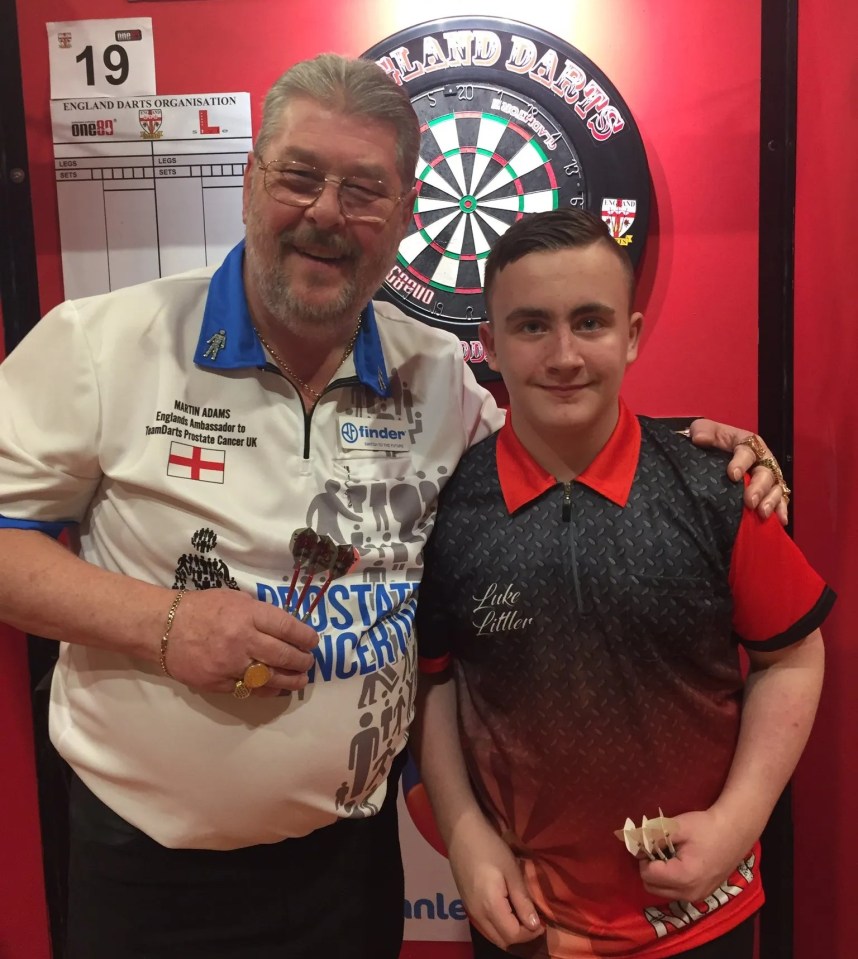 Littler with Martin Adams as he continued his journey to the top of darts