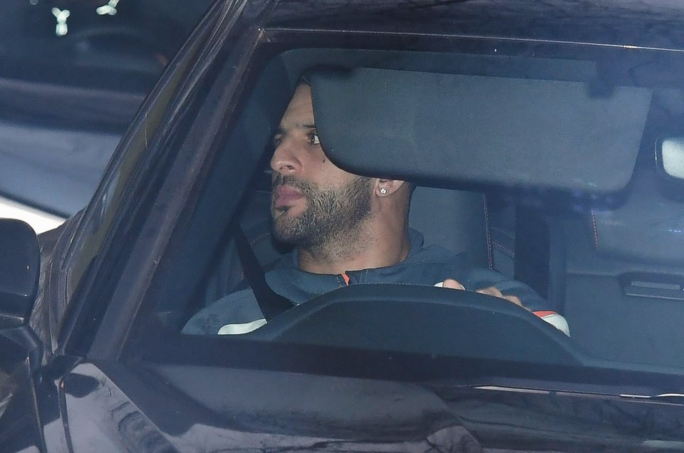 Pictured is Manchester City's Kyle Walker - attempting not to be seen - arriving in his Audi at the teams training centre before travelling with the team to Newcastle ahead of their match (on Sat 13th Jan)