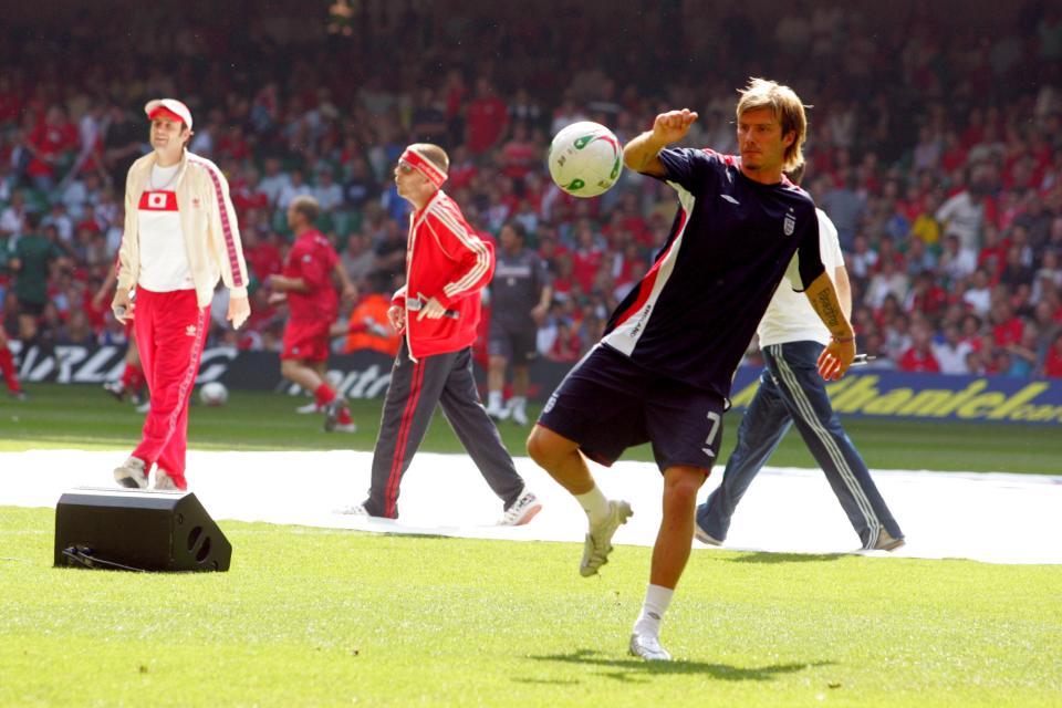 Goldie Lookin Chain performing while David Beckham warms up