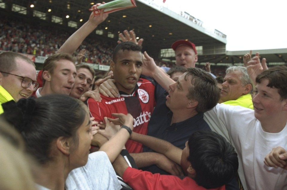 3 May 1997: Pierre Van Hooijdonk of Nottingham Forest, surrounded by fans after the FA Carling Premier League match against Wimbledon at the City Ground in Nottingham, England. The game was drawn 1-1. \\ Mandatory Credit: Alex Livesey /Allsport