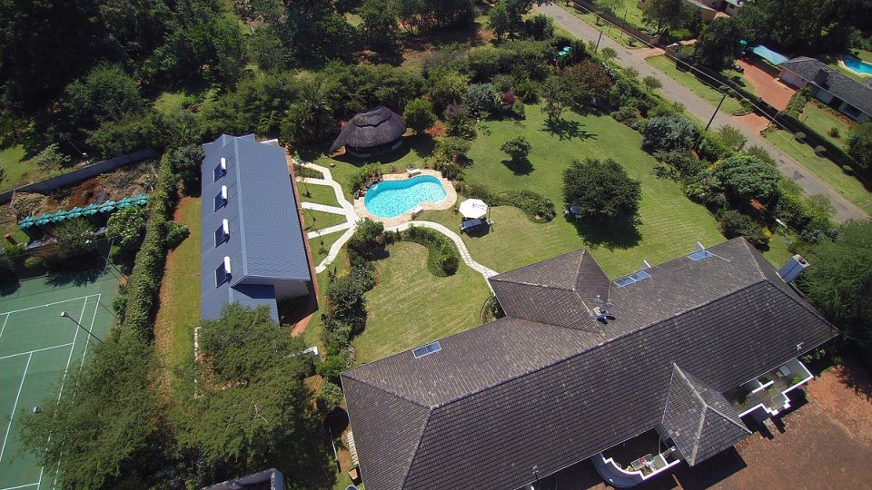 The land features a swimming pool and beautiful grounds