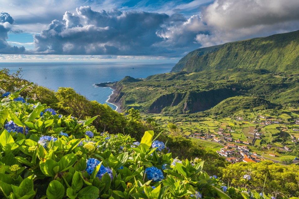 The island is named after blue flowers and is described as paradise on Earth