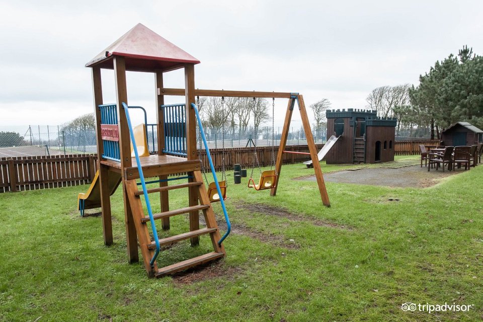 The park has a children's play area including a mini castle for kids to play on