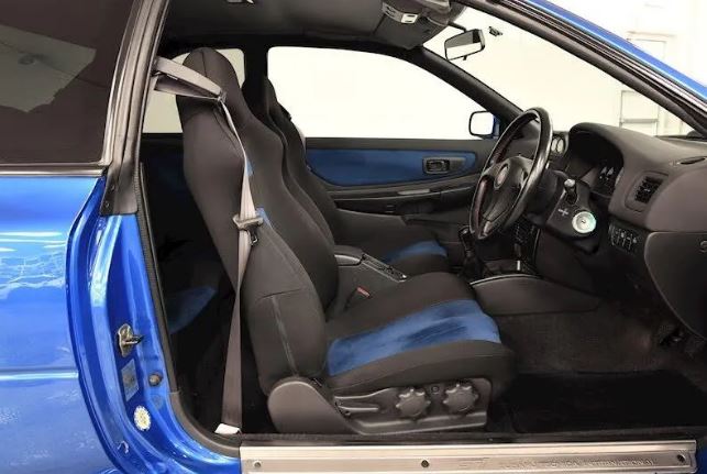 The beautiful blue and black interior gives it a high performance feel