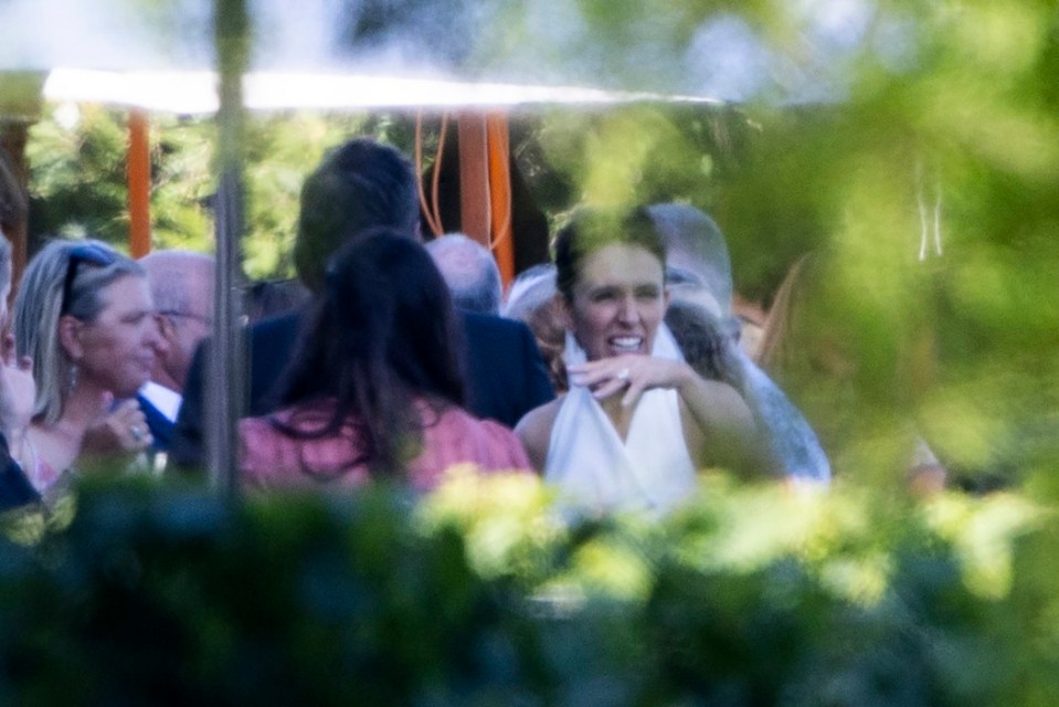 Former New Zealand Prime Minister Jacinda mingling with guests at her wedding.