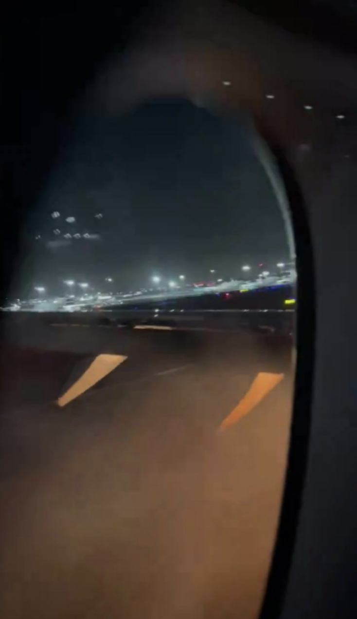 The view from inside of the plane of the moment it landed after colliding with a Japanese coastguard plane