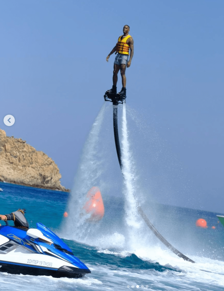 Toney enjoys a ride on a hoverboard at sea