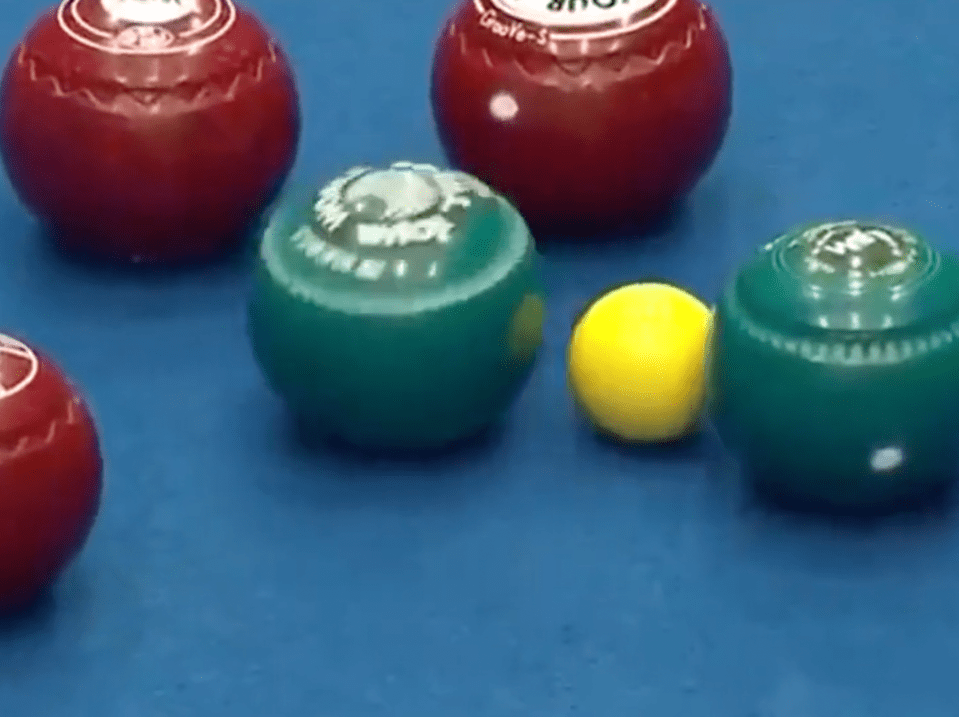 The ball knocked the jack next to another one of his balls