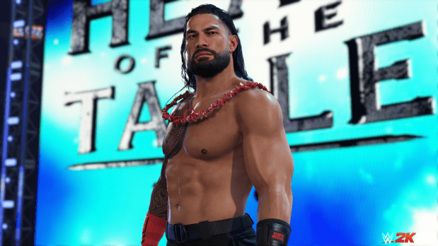 roman reigns is standing in front of a sign that says the tale