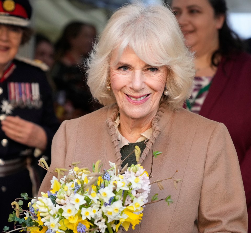 Queen Camilla made a royal style blunder when she headed out in mismatched earrings on Monday