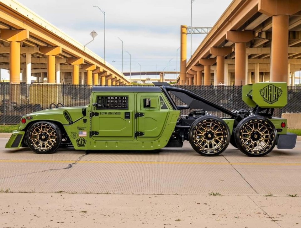 The Humvee is far from standard, with an upgrade to six wheels and lowered suspension