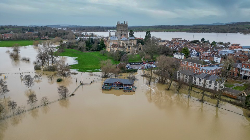 Tewkesbury Abbey, at the confluence of the Rivers Severn and Avon, is surrounded by flood waters after heavy rain yesterday