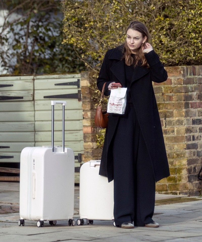 Olivia was pictured waiting outside the actor's home in London