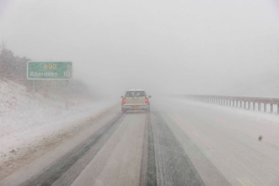 A driver tentatively makes their way along the road near Aberdeen