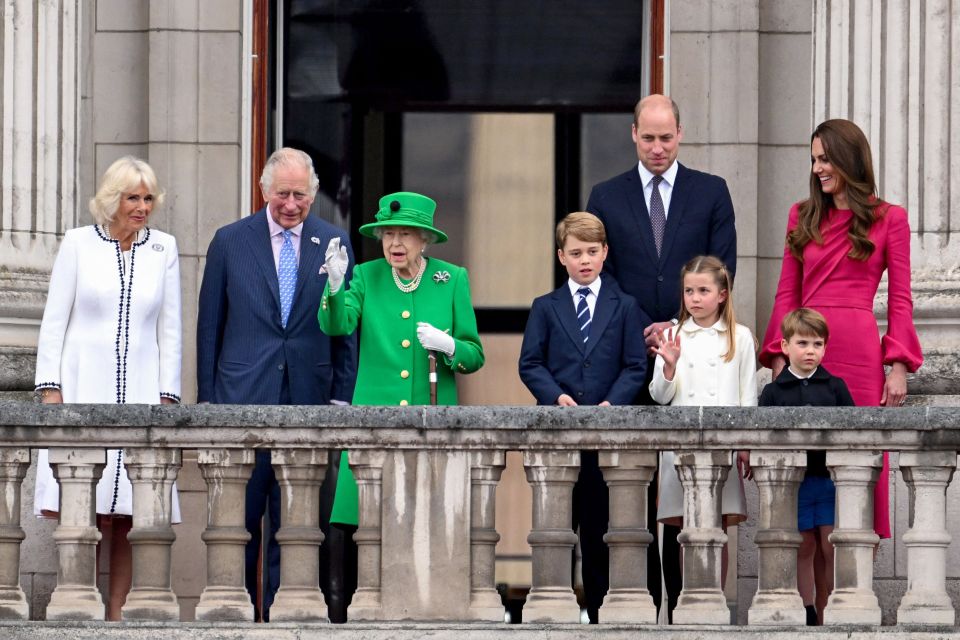 Queen Elizabeth II stands on Buckingham Palace balcony with Camilla, Charles, George  William, Charlotte and Kate