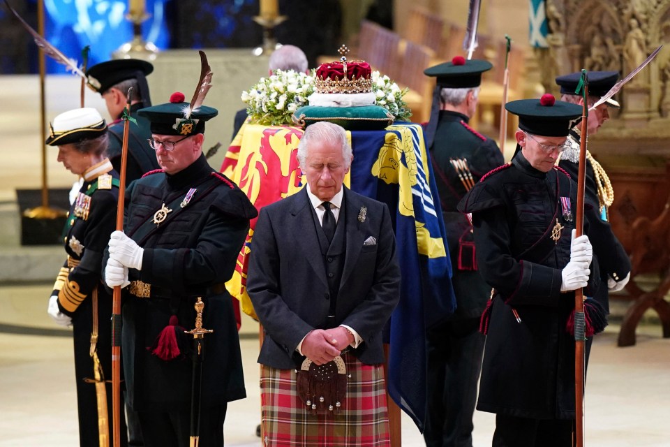 Britain’s King Charles III, center, and other members of the royal family hold a vigil at the coffin of Queen Elizabeth II at St Giles’ Cathedral