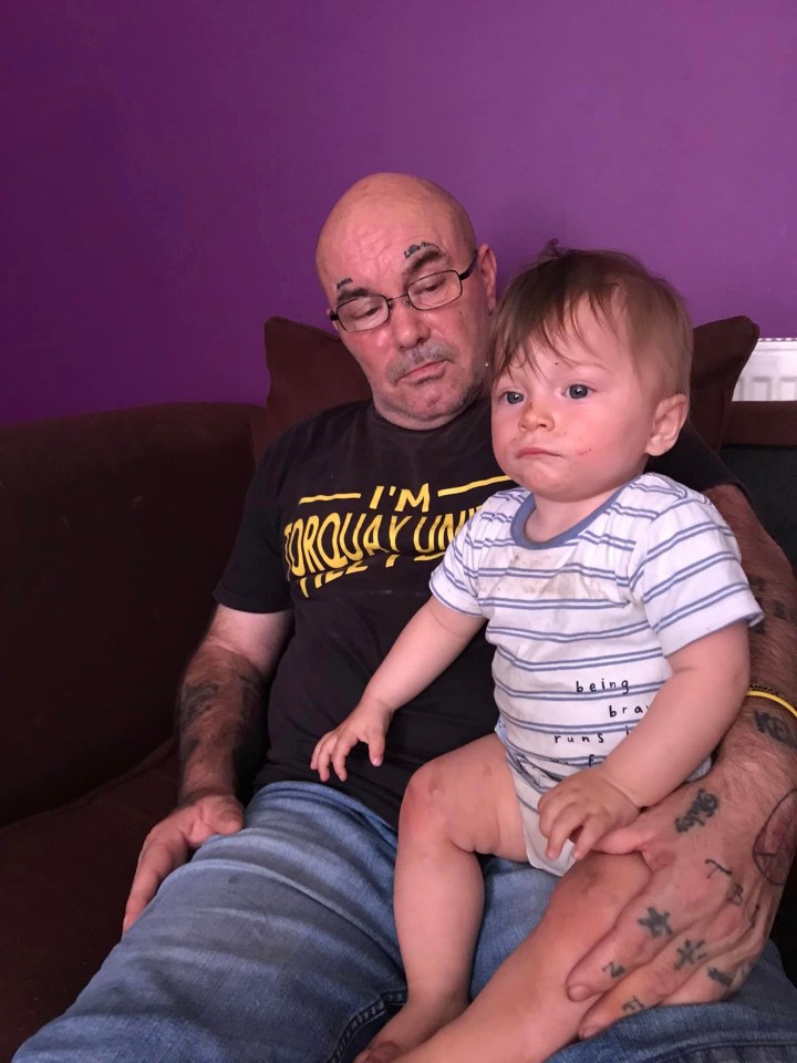 The tragic little boy, 2, pictured with father Kenneth, who died of a heart attack soon after Boxing Day