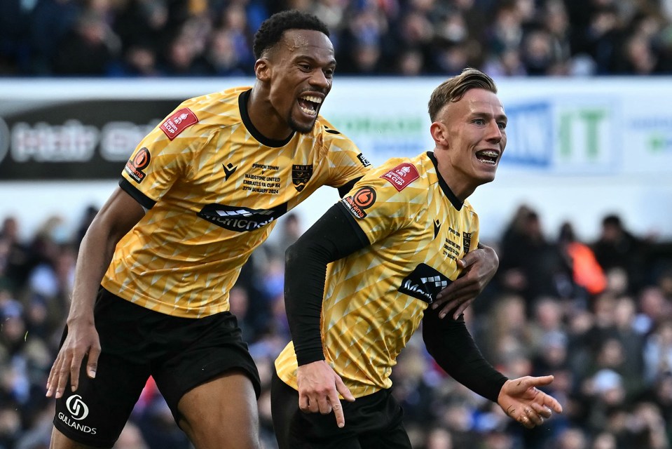 Sam Corne, right, celebrates his goal with Manny Duku