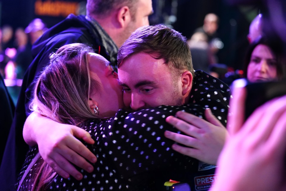 Luke Littler received a hug from his mum Lisa after reaching the final