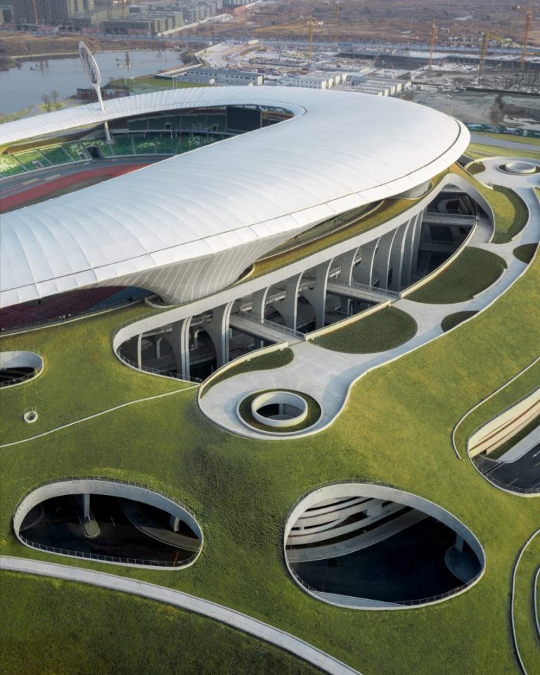 The Quzhou Stadium in China is built inside a hill with much of it being underground to blend in with the surrounding area