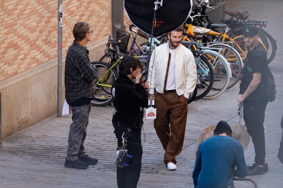 The former footballer was filming a commercial for the beer brand in the winter sunshine