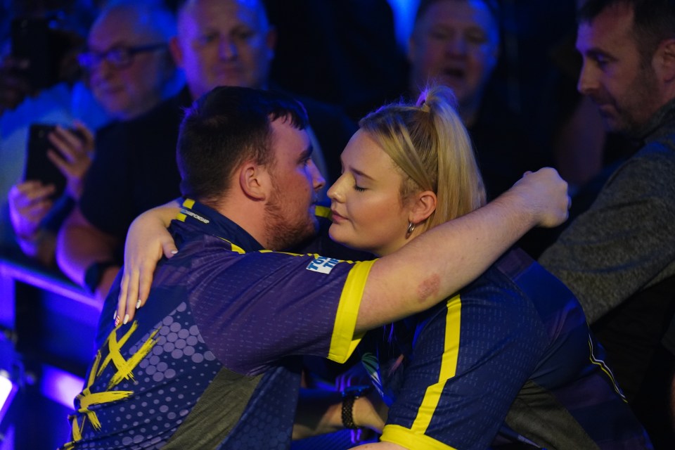 Luke Littler hugged Eloise on his way to the Ally Pally stage before the final