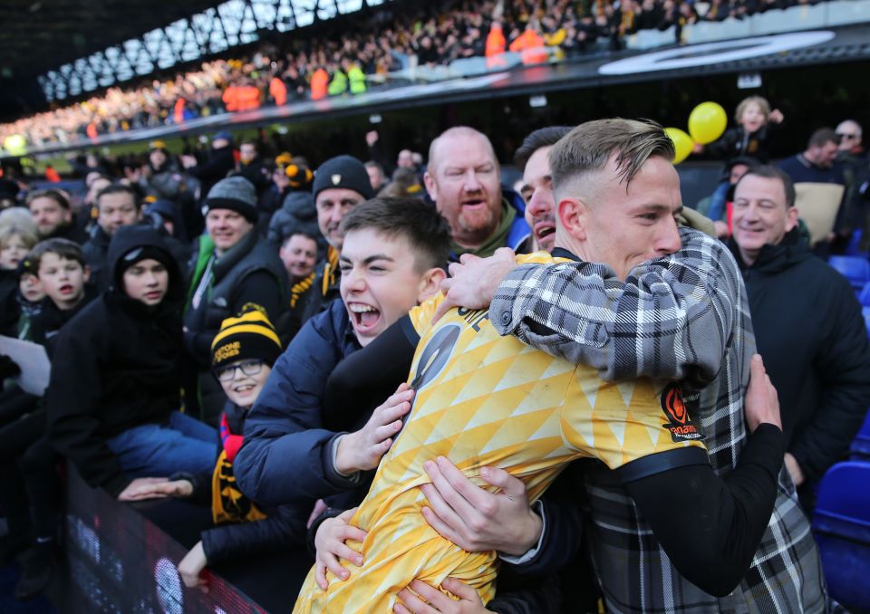 Sam Corne of Maidstone celebrates with travelling fans