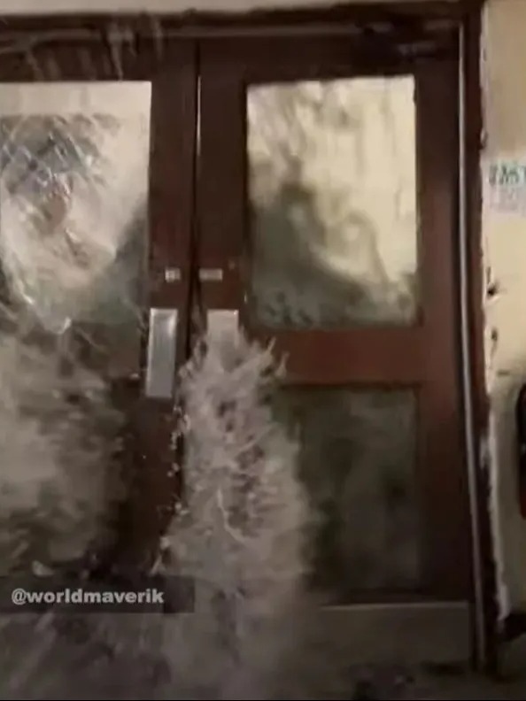 The first wave came crashing through a set of doors inside the US Army base