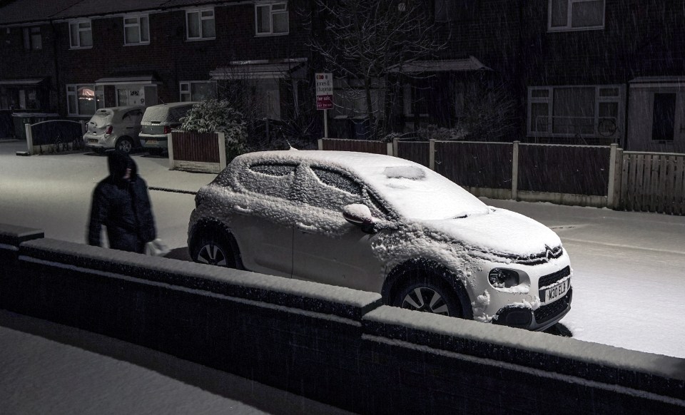 Fresh snow covered the roads and footpaths during snowfall in Lee Park, Liverpool this morning