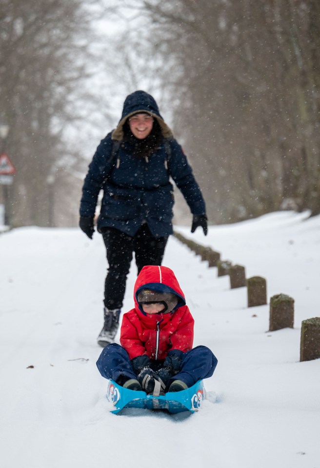 A family enjoying their snow day in Huntly Aberdeenshire