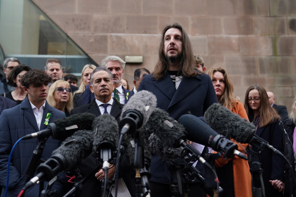 Ian Coates son, James, making a statement alongside relatives of the victims